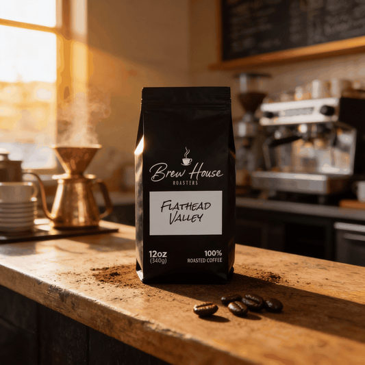Flathead Valley dark roast coffee bag with coffee beans on wooden counter in cozy cafe setting